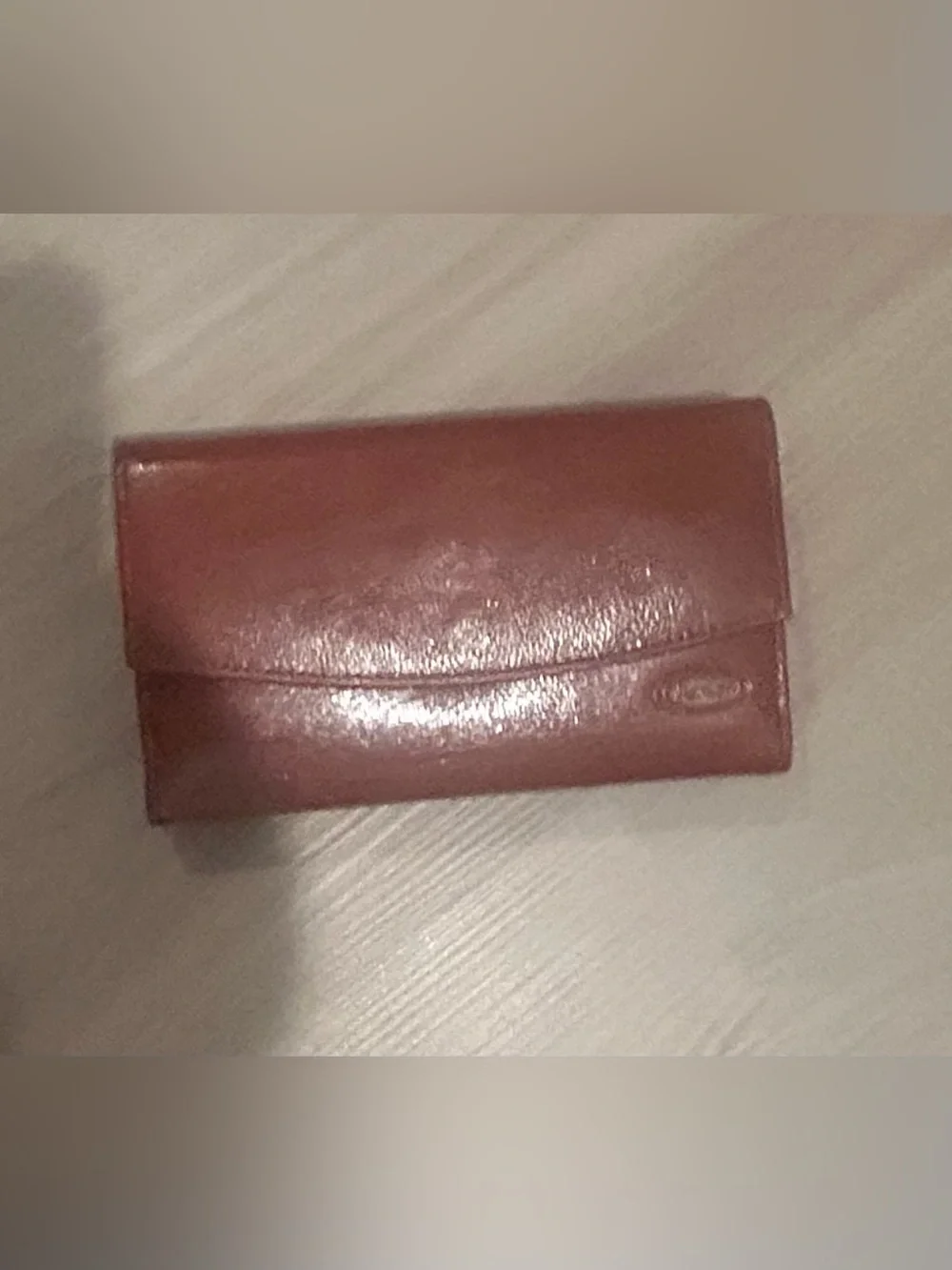 Rolfs brown leather card case with gold detail